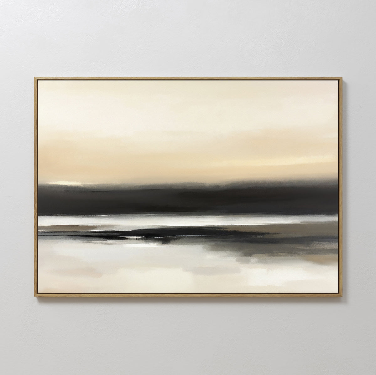 Quiet Shoreline Canvas Art - Horizontal features serene abstract beige, cream, and black tones with soft blended horizontal layers, evoking a minimalist coastal vibe. A thin gold frame sets off the piece against a plain white wall.