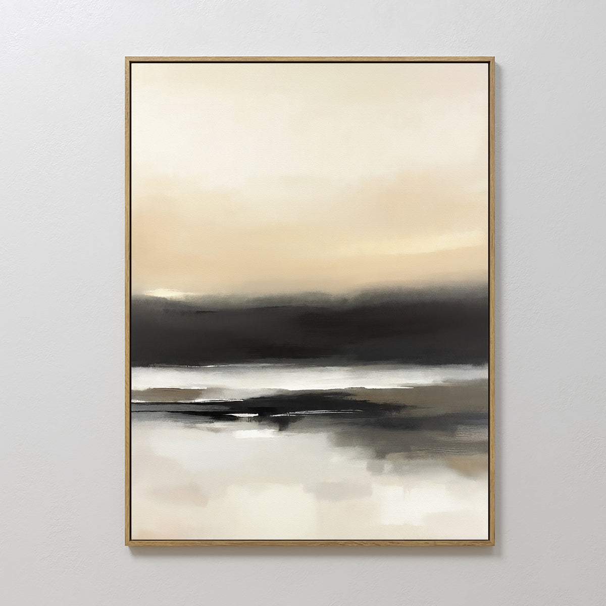 The Quiet Shoreline Canvas Art - Vertical features soft, blended tones of beige, cream, gray, and black to evoke a calm coastal landscape. This serene framed art is displayed on a plain light-colored wall.