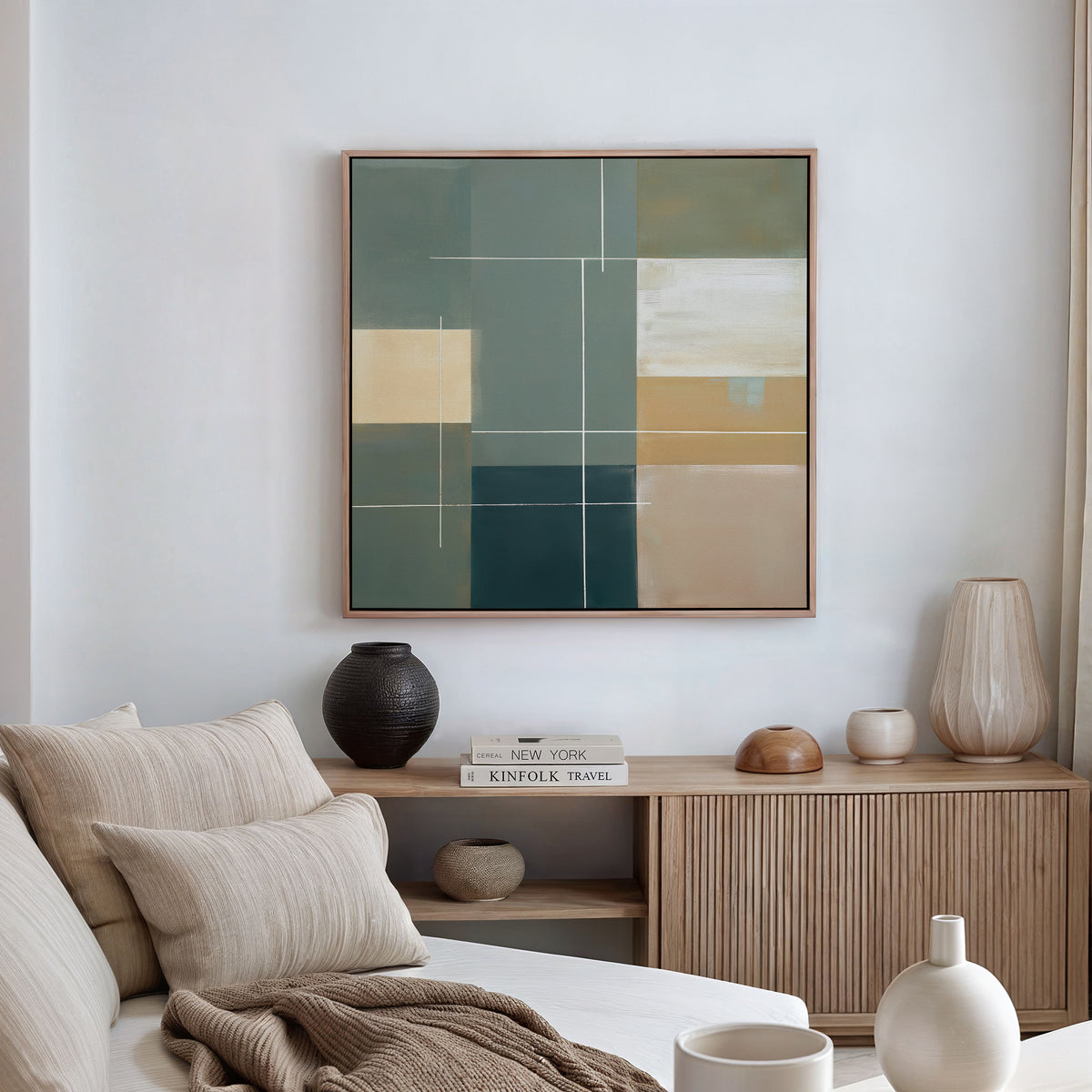 A modern living room with a beige sofa, neutral pillows, and a wooden sideboard topped with books and ceramic vases. Above the sideboard hangs the Sage Compartments Canvas Art - Square, adding striking abstract style to the space.