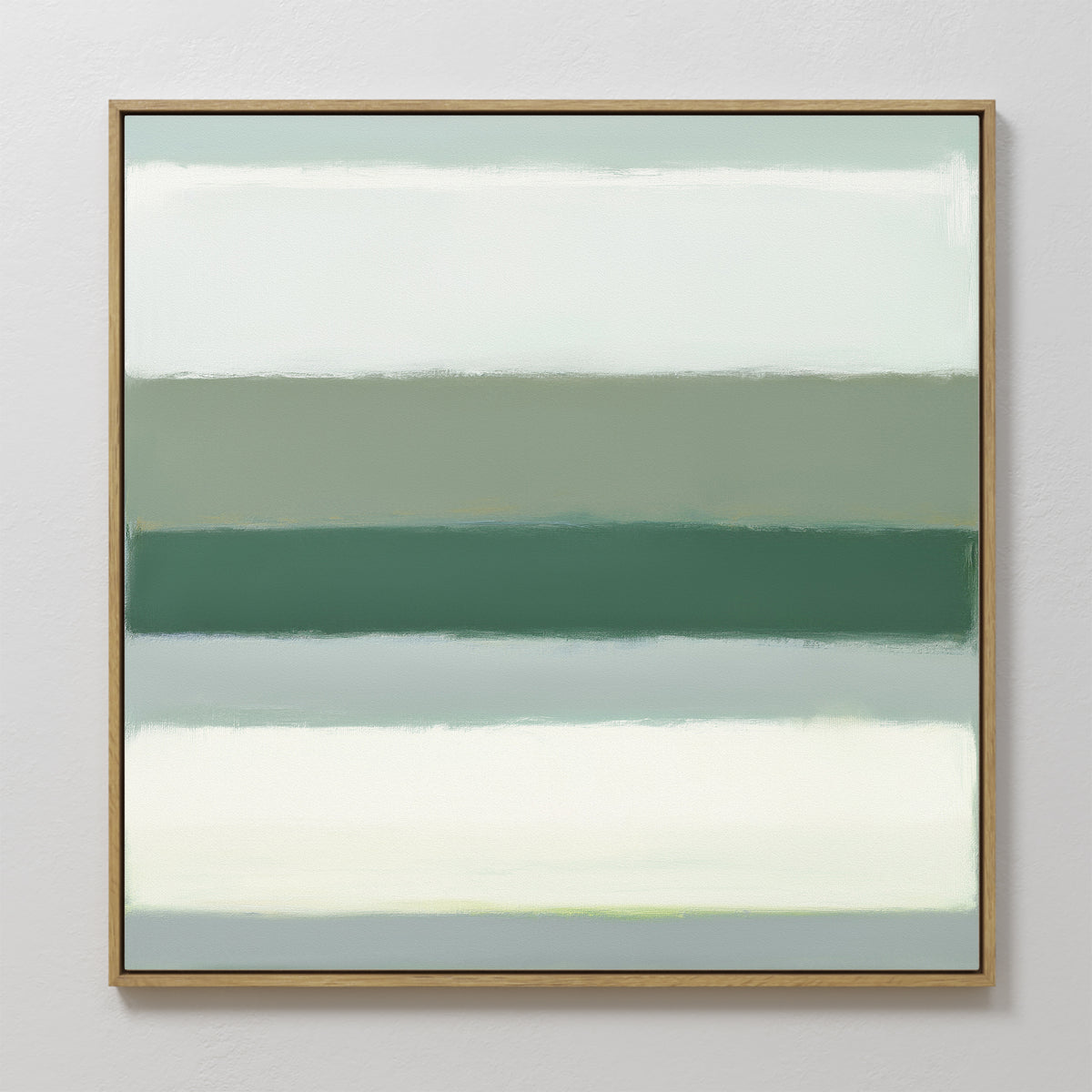 Sage Gradient Canvas Art - Square features softly blended horizontal bands of muted green, teal, and off-white in a serene sage gradient on canvas, set in a thin gold frame against a light textured wall.
