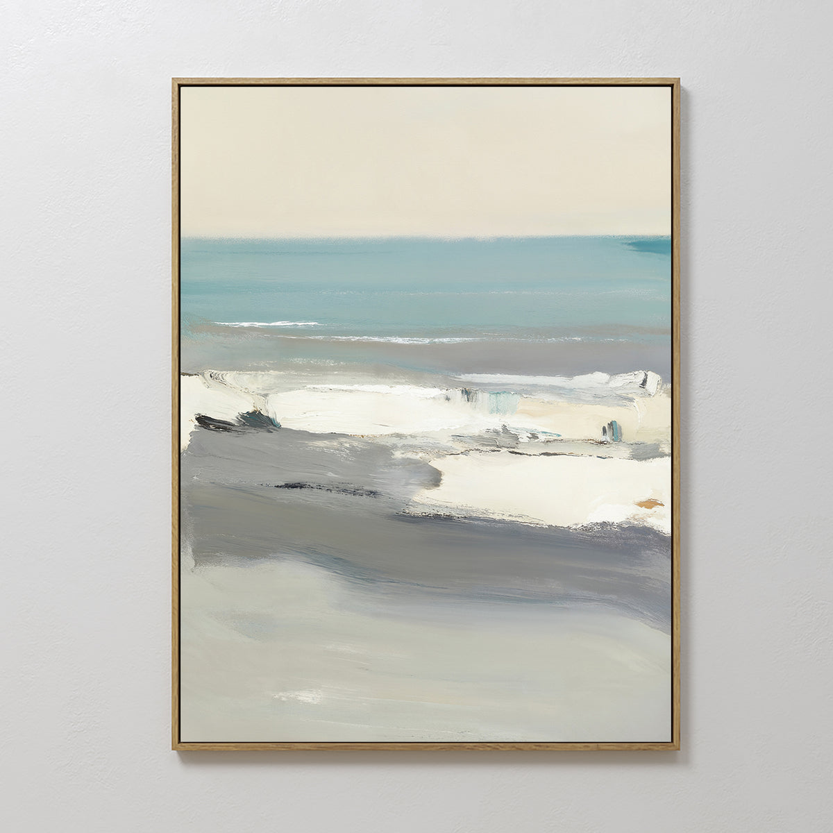 The Sandy Retreat Canvas Art - Vertical features a framed abstract coastal seascape in muted blue, gray, white, and beige tones with soft brushstrokes, evoking gentle waves and calm skies for a relaxing seaside atmosphere.