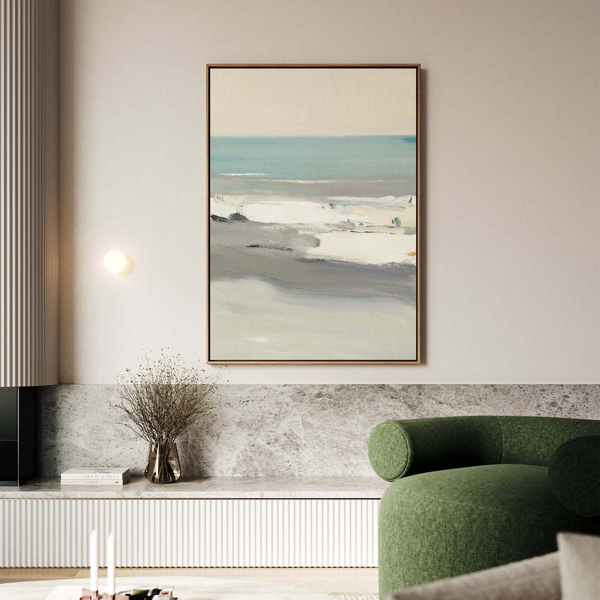 A minimalist living room featuring a green armchair, marble surfaces, dried flowers in a vase, and the Sandy Retreat Canvas Art - Vertical above the built-in shelf adds subtle seaside vibes to the space.