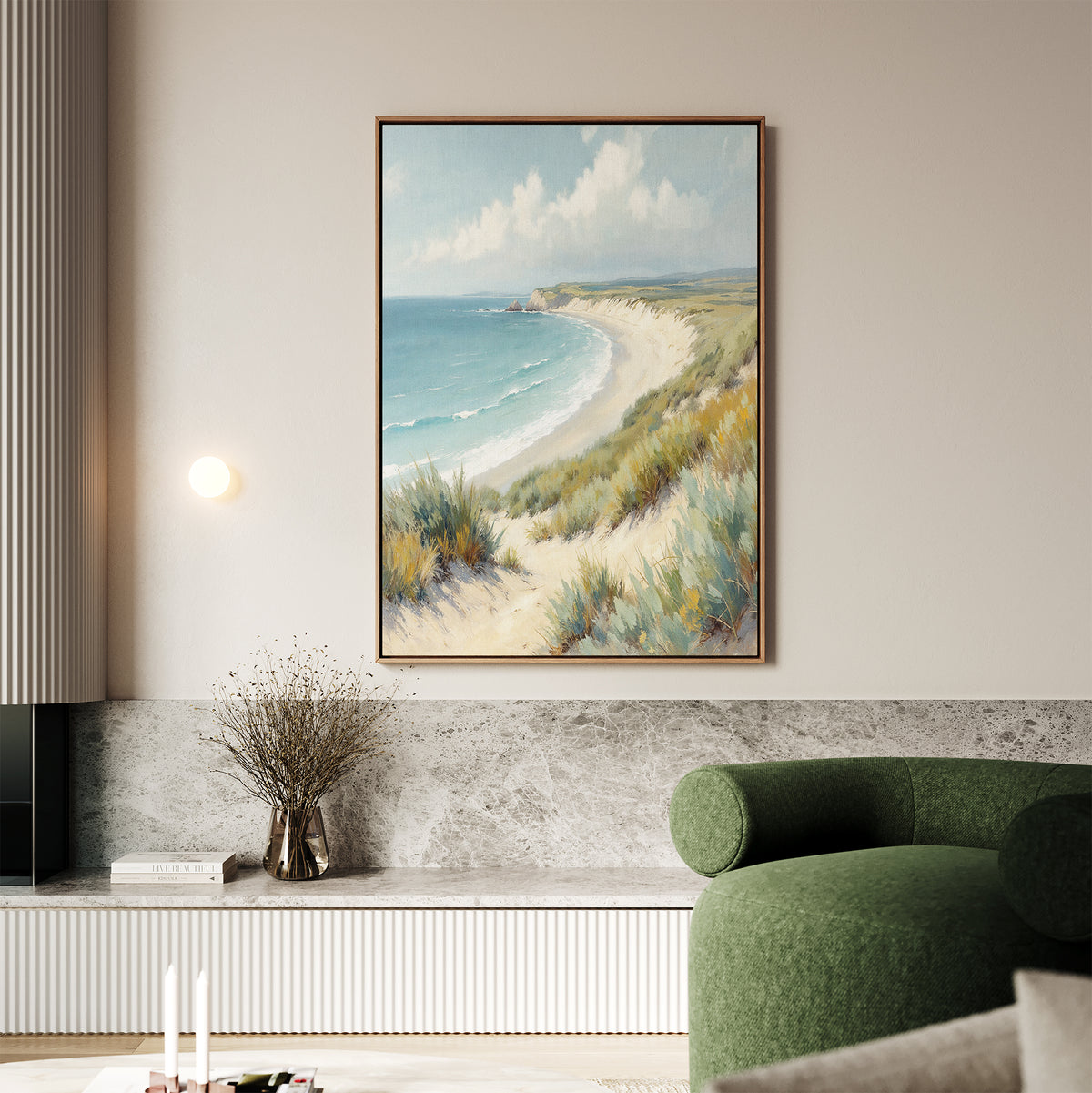 The Sandy Shores Canvas Art - Vertical adds a coastal touch above a stone shelf in a modern living room, featuring a green sofa, minimalist decor, and light walls.