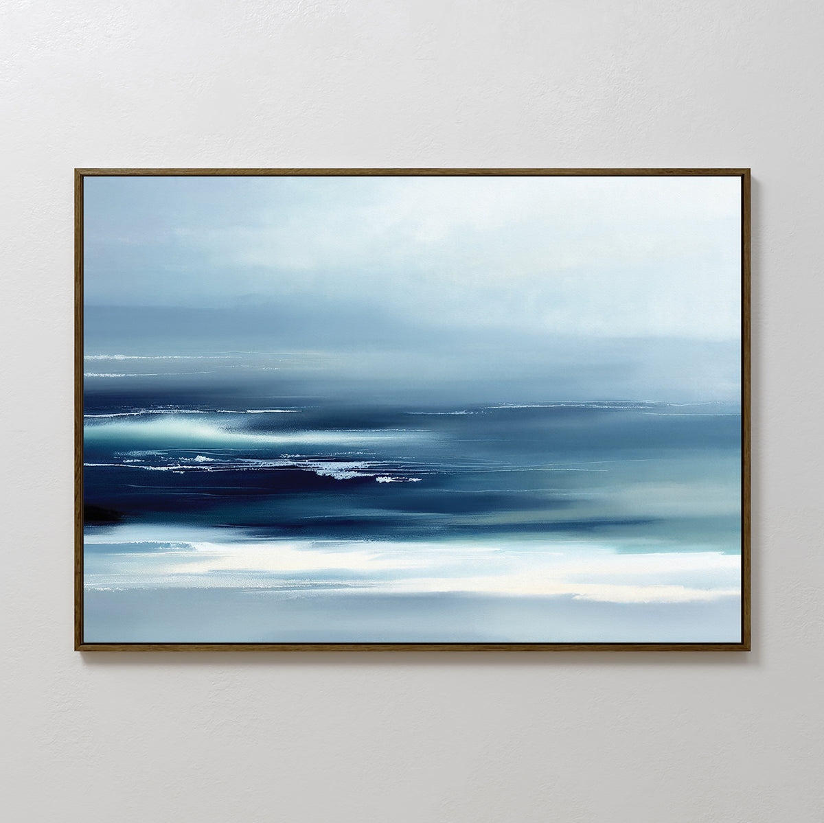 The Sapphire Current Canvas Art - Horizontal features abstract cool blue and white tones evoking a serene seascape, framed with a thin dark border and displayed on a plain white wall.