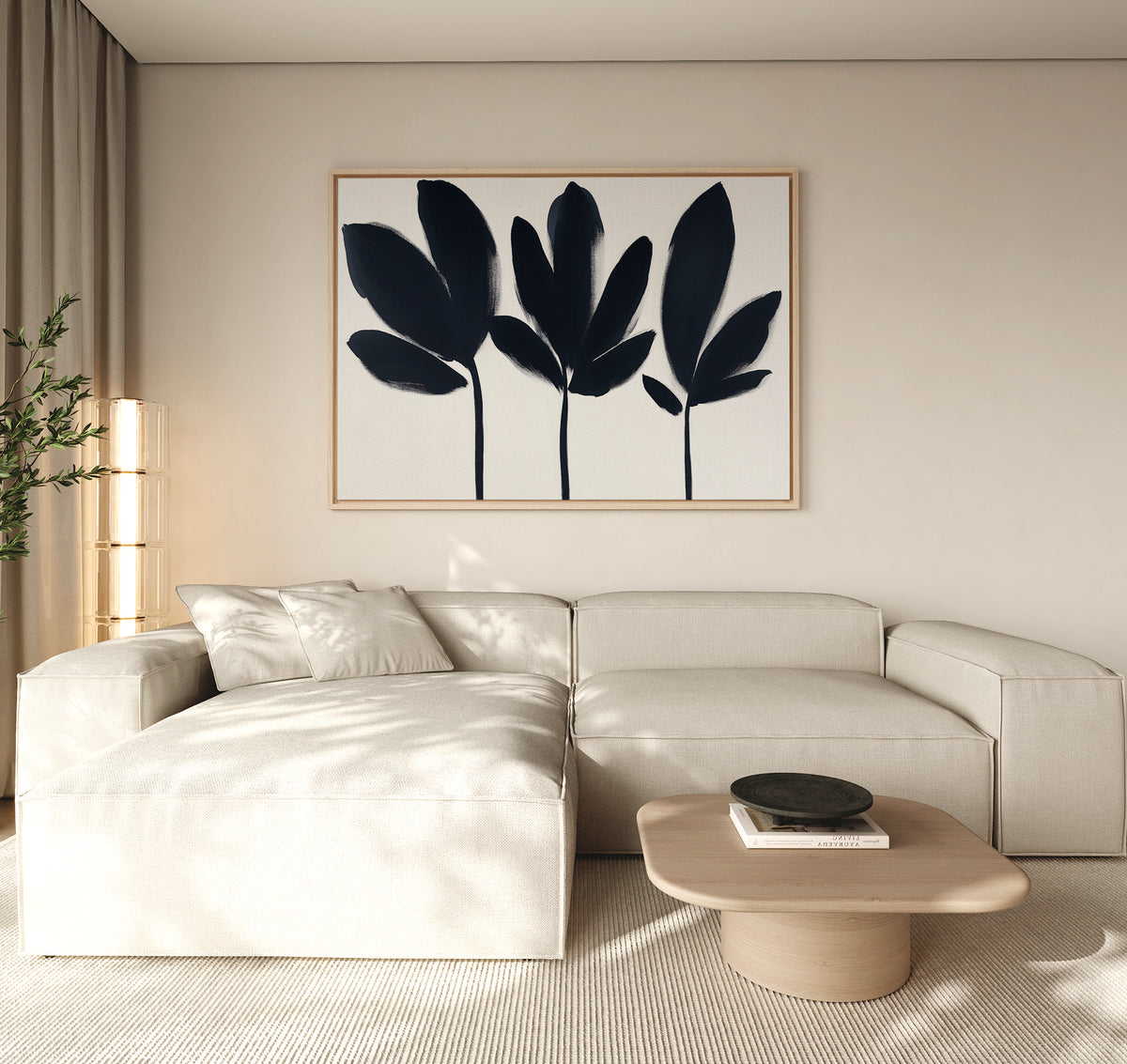 A modern living room with a beige sectional, light wood coffee table, and black decorative bowl features the Shadow Stems Canvas Art - Horizontal above the sofa. Neutral tones and natural light fill the space.