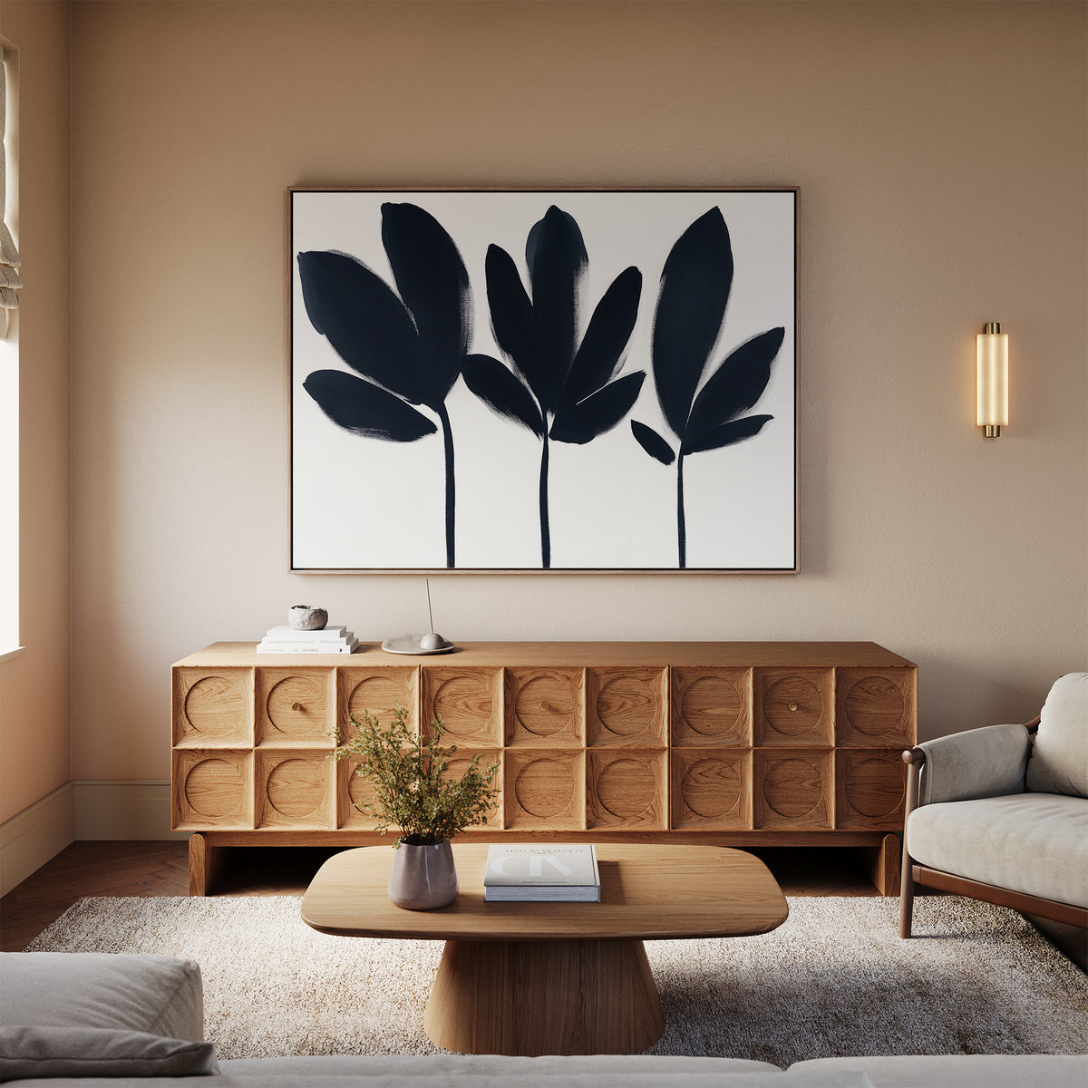 A modern living room featuring a wooden sideboard with circular patterns, a coffee table, a beige sofa, and the Shadow Stems Canvas Art - Horizontal displayed above the sideboard.