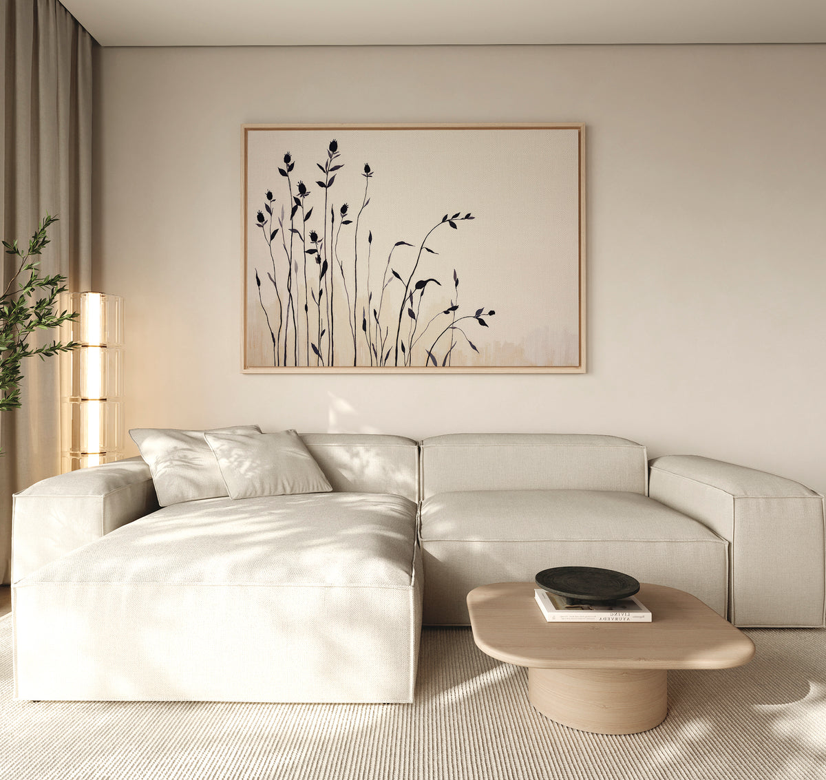 Minimalist living room featuring a light beige sectional, Nordic decor, wooden coffee table with dark bowl, soft natural light, and neutral tones. The serene space is completed by Silhouette Meadow Canvas Art - Horizontal and a leafy plant.