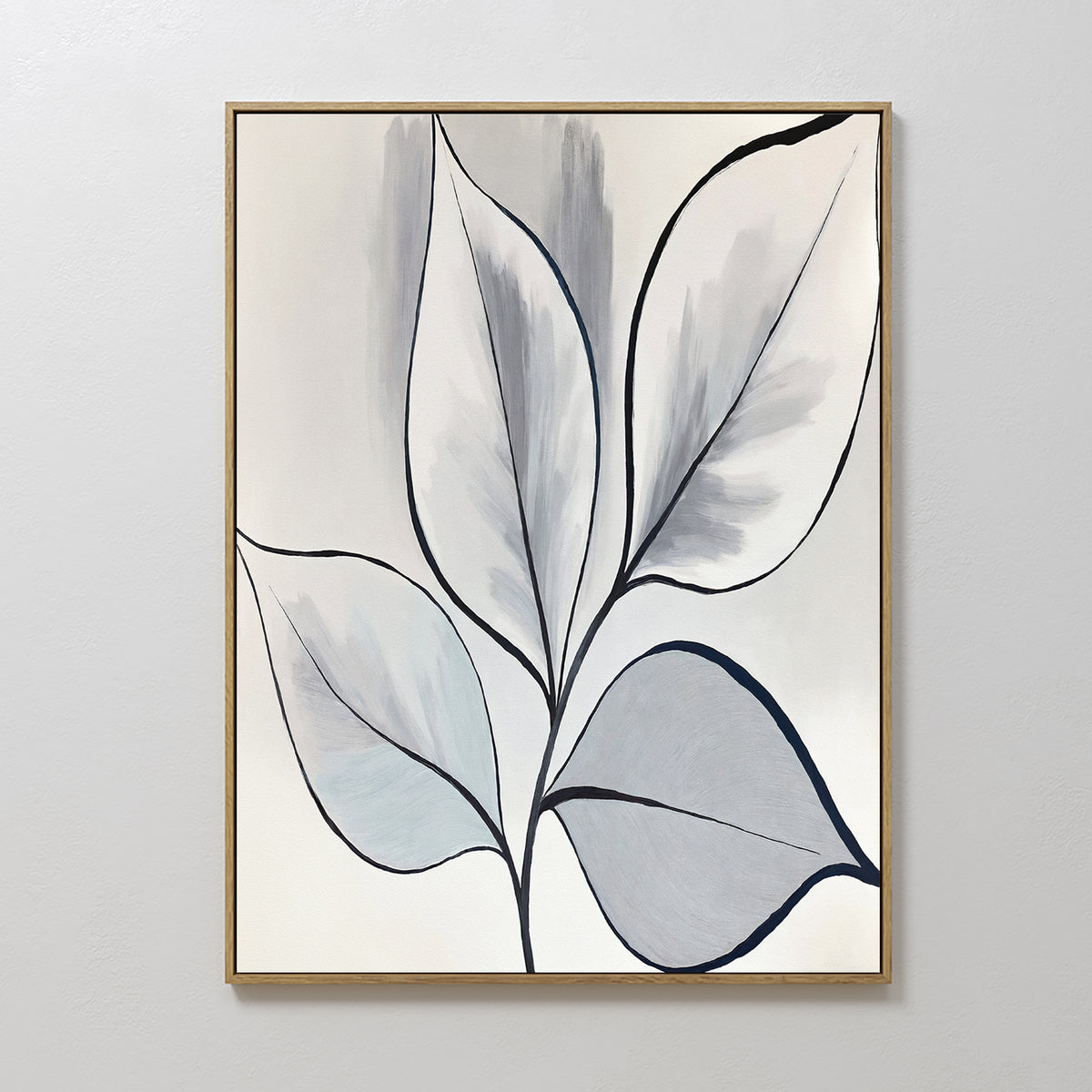 Silver Leaves Canvas Art - Vertical features abstract leaves with black outlines in gray, blue, and white tones. Set in a thin gold frame on a light wall, it’s ideal for modern home decor.
