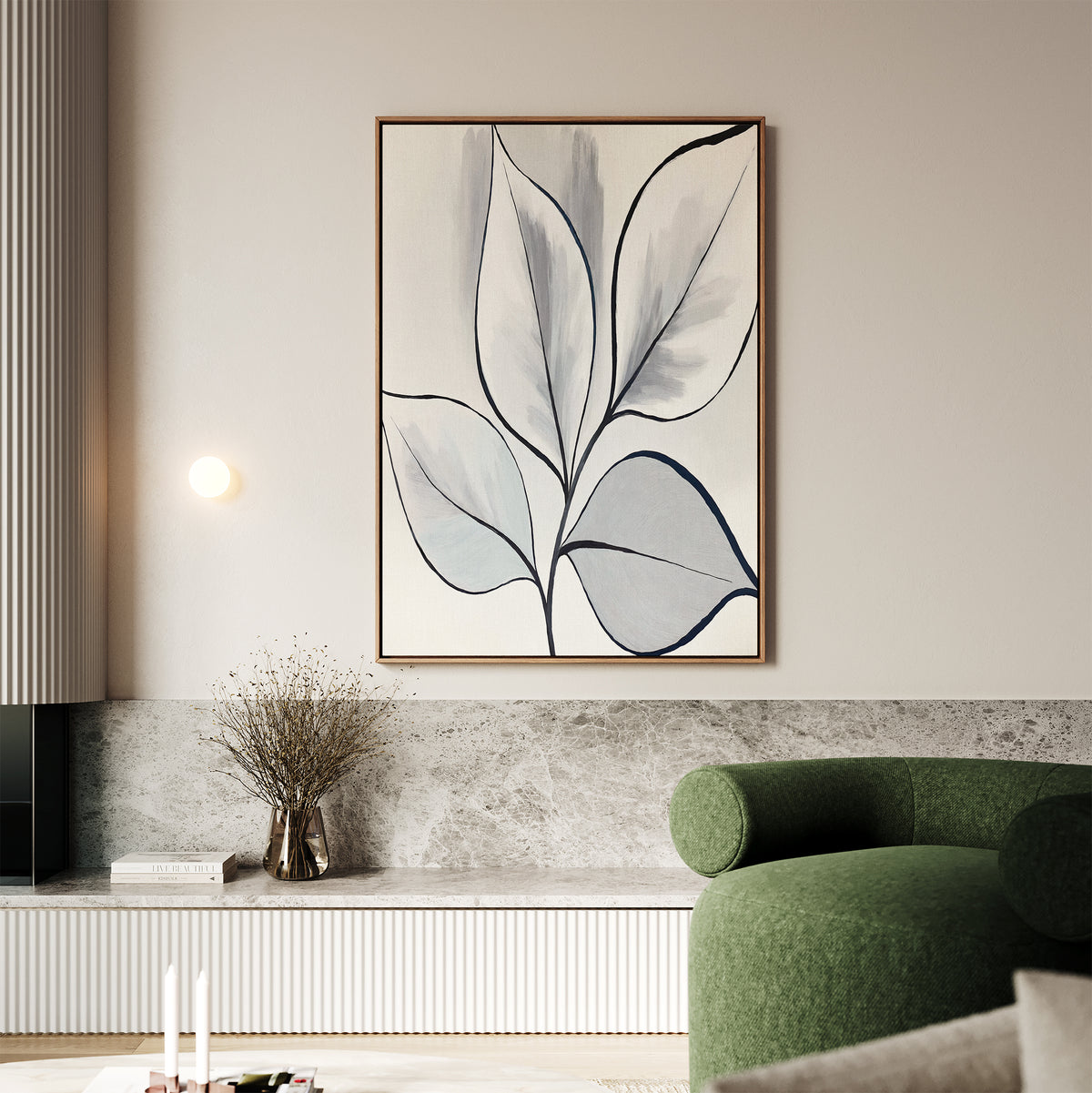 Minimalist living room featuring the Silver Leaves Canvas Art - Vertical in a wooden frame, a green curved sofa, round wall light, dried flowers in a vase, and neutral-toned modern home decor.