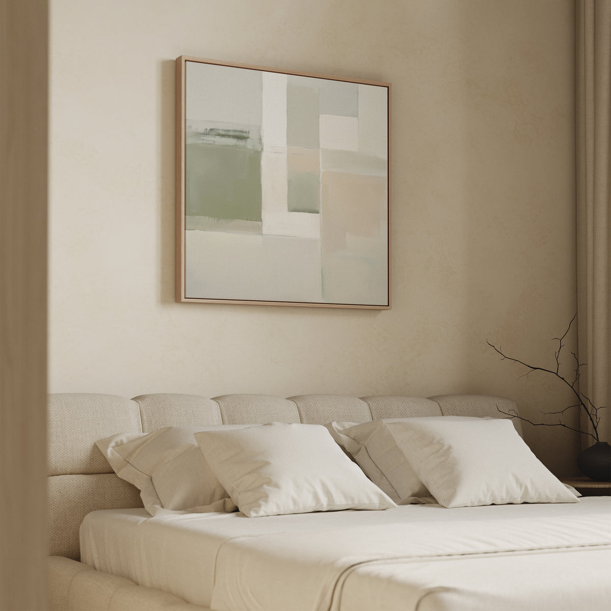 A minimalist bedroom features a beige bed, four white pillows, and the Soft Geometric Planes Canvas Art - Square in soft green and neutral tones above the headboard, plus a bare branch in a vase on the side table for a modern look.