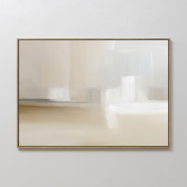 Soft Layers Canvas Art - Horizontal features a neutral palette of beige, white, cream, and light gray with blurred brushstrokes for a calm minimalist look. Framed in gold and displayed on a white wall—an ideal abstract print.