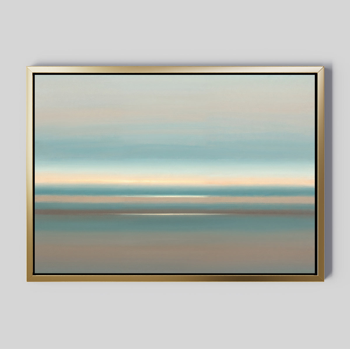The Soft Tide Layers Canvas Art - Horizontal features abstract landscape bands in soft blue, beige, and gray tones. This calming print is framed with a simple gold border and displayed on a light gray wall.