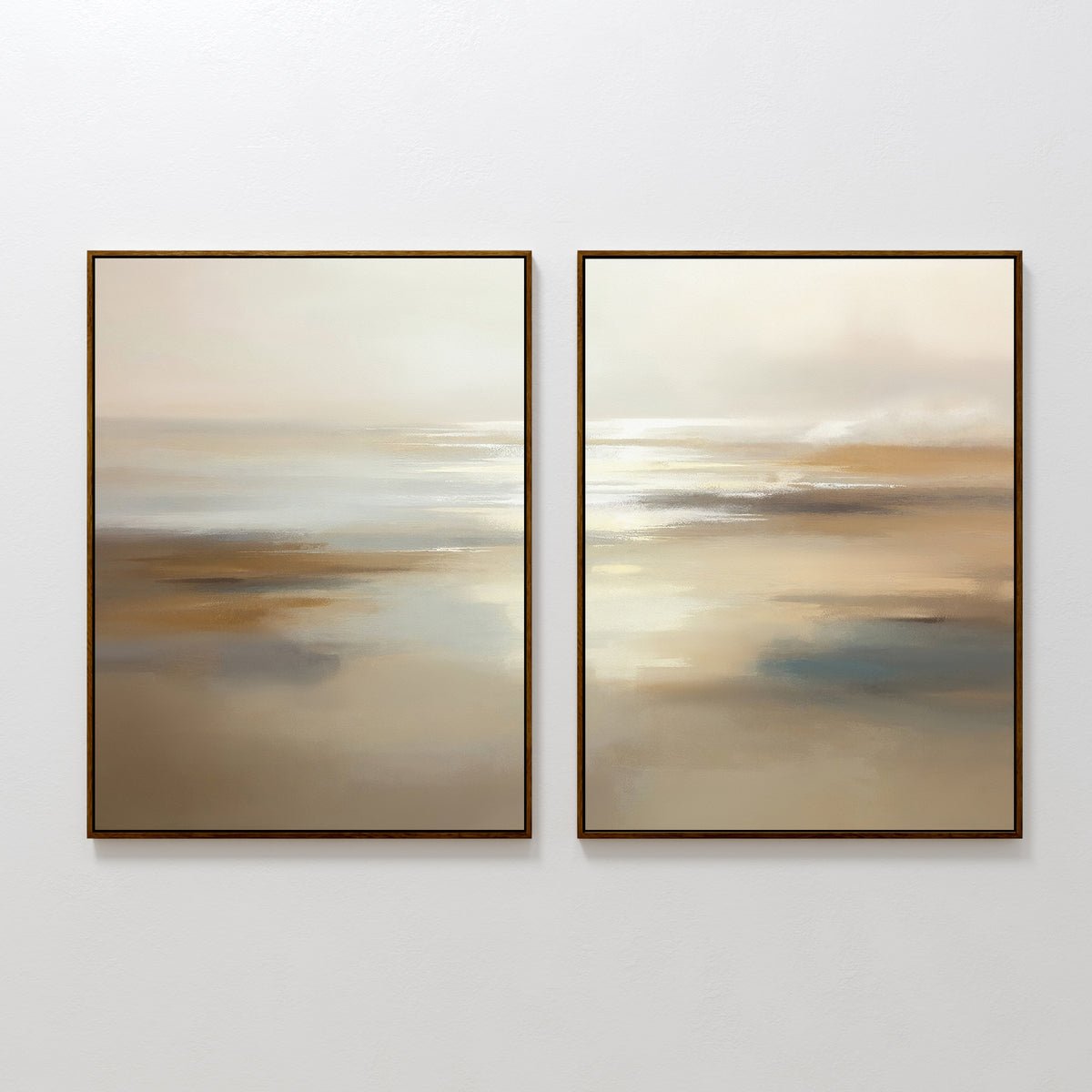 The "Sunlit Waters - Set Of 2" features framed abstract landscape paintings in soft beige, brown, blue, and white tones, evoking tranquil misty seascapes or sunlit waters as elegant wall art on a plain white wall.