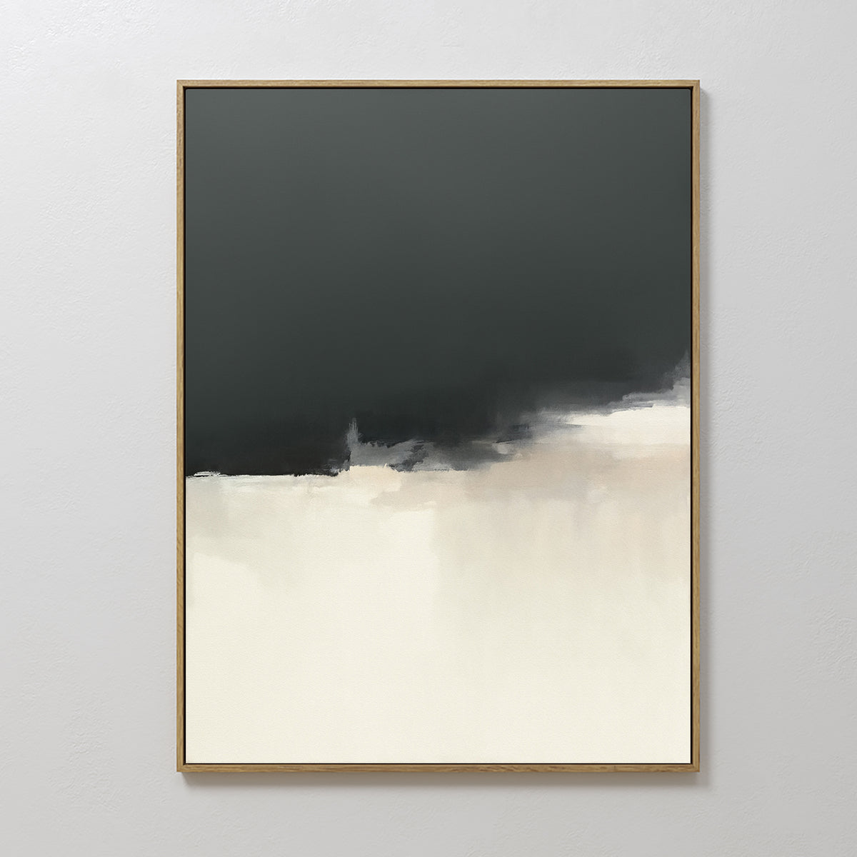 The Tempest Brewing Canvas Art - Vertical features a minimalistic abstract design with a dark gray upper half blending into a light cream lower half. Its soft, blurred edges create atmospheric wall art, shown hanging on a plain white wall.