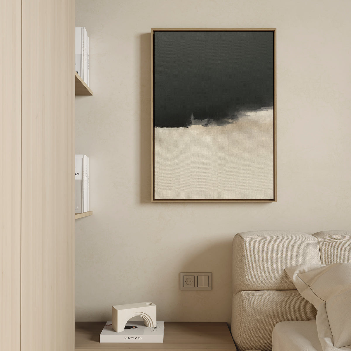 Minimalist interior with a beige sofa, a wooden shelf with books, a small abstract sculpture, and the Tempest Brewing Canvas Art - Vertical—a large framed abstract painting—on a cream-colored wall.
