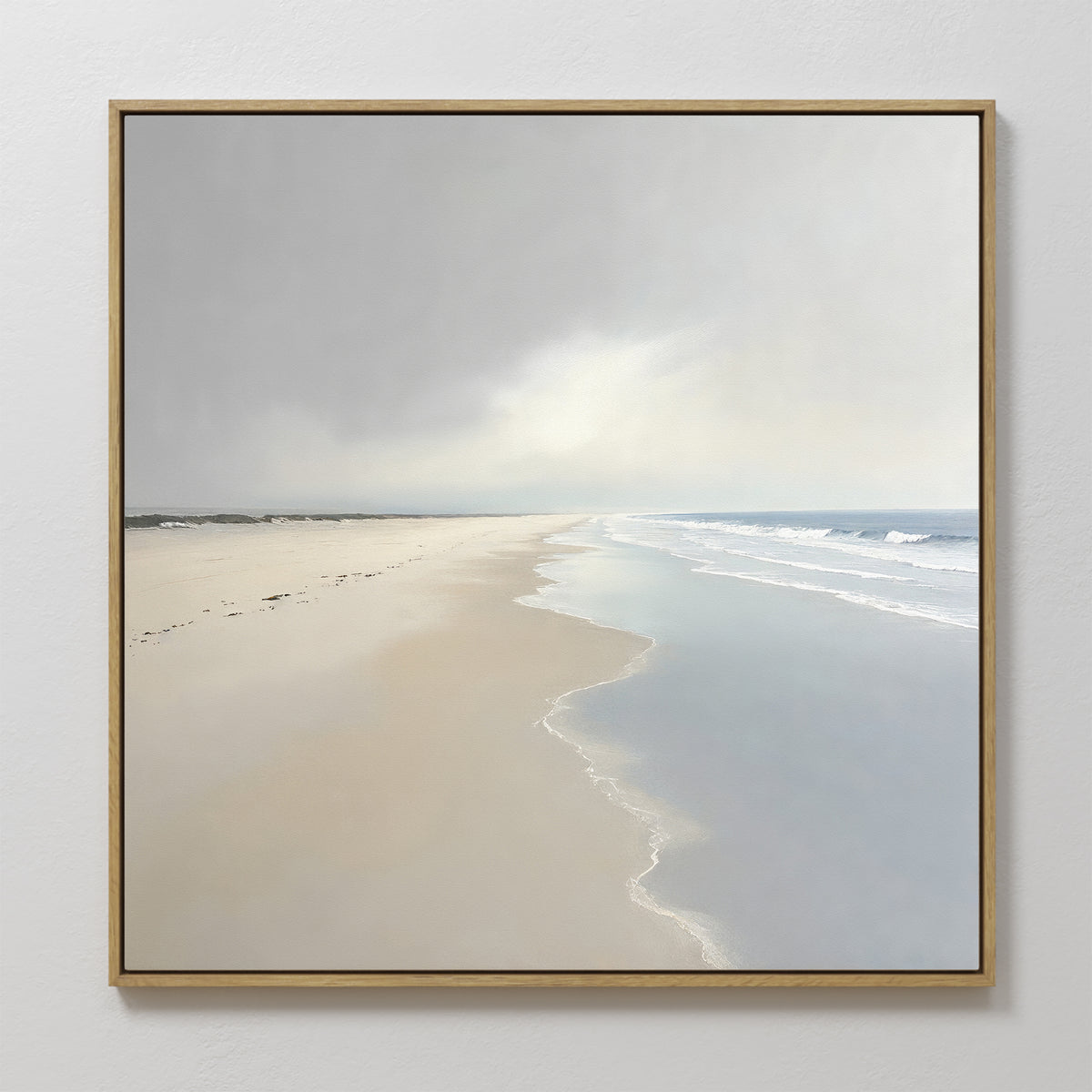 Tidal Reflections Canvas Art - Square features a serene beach with gentle waves, soft sand, and faint footprints under a cloudy sky—ideal wall decor for adding peaceful, calming ocean vibes to any space.