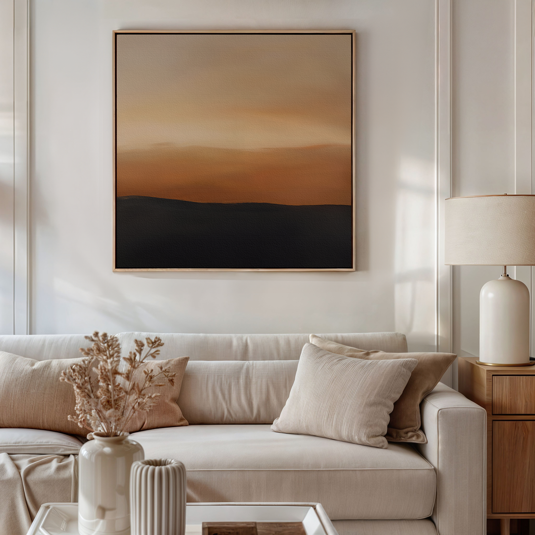 A neutral-toned living room with a beige sofa, light cushions, a dried floral arrangement in a striped vase, and the Tranquil Vista Abstract Canvas Art—ideal for those who love refined decor in warm brown and orange gradients.