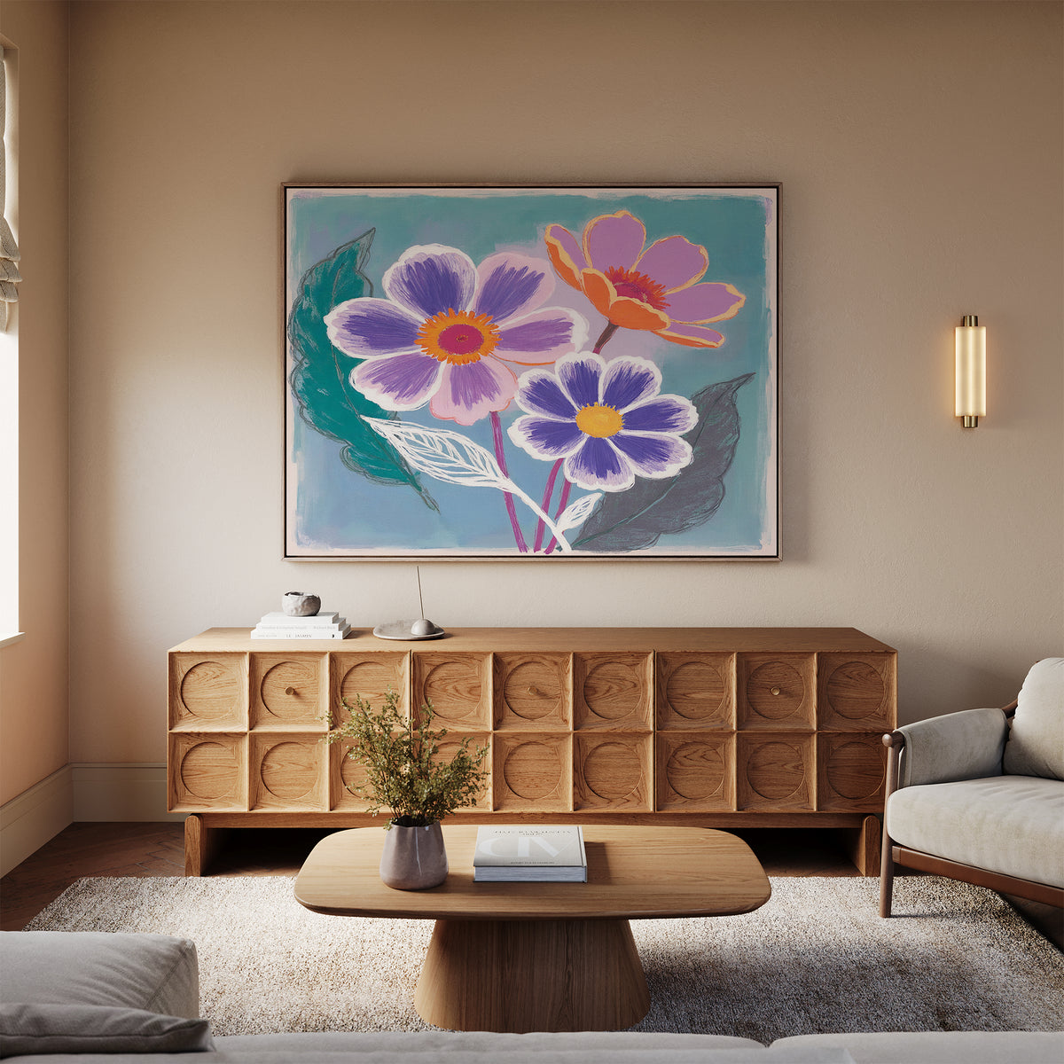 A cozy living room with a light sofa, wooden coffee table, and sideboard showcasing the Vibrant Petals Canvas Art - Horizontal—a large, colorful floral painting. A vase with flowers on the table adds to the bright and inviting decor.