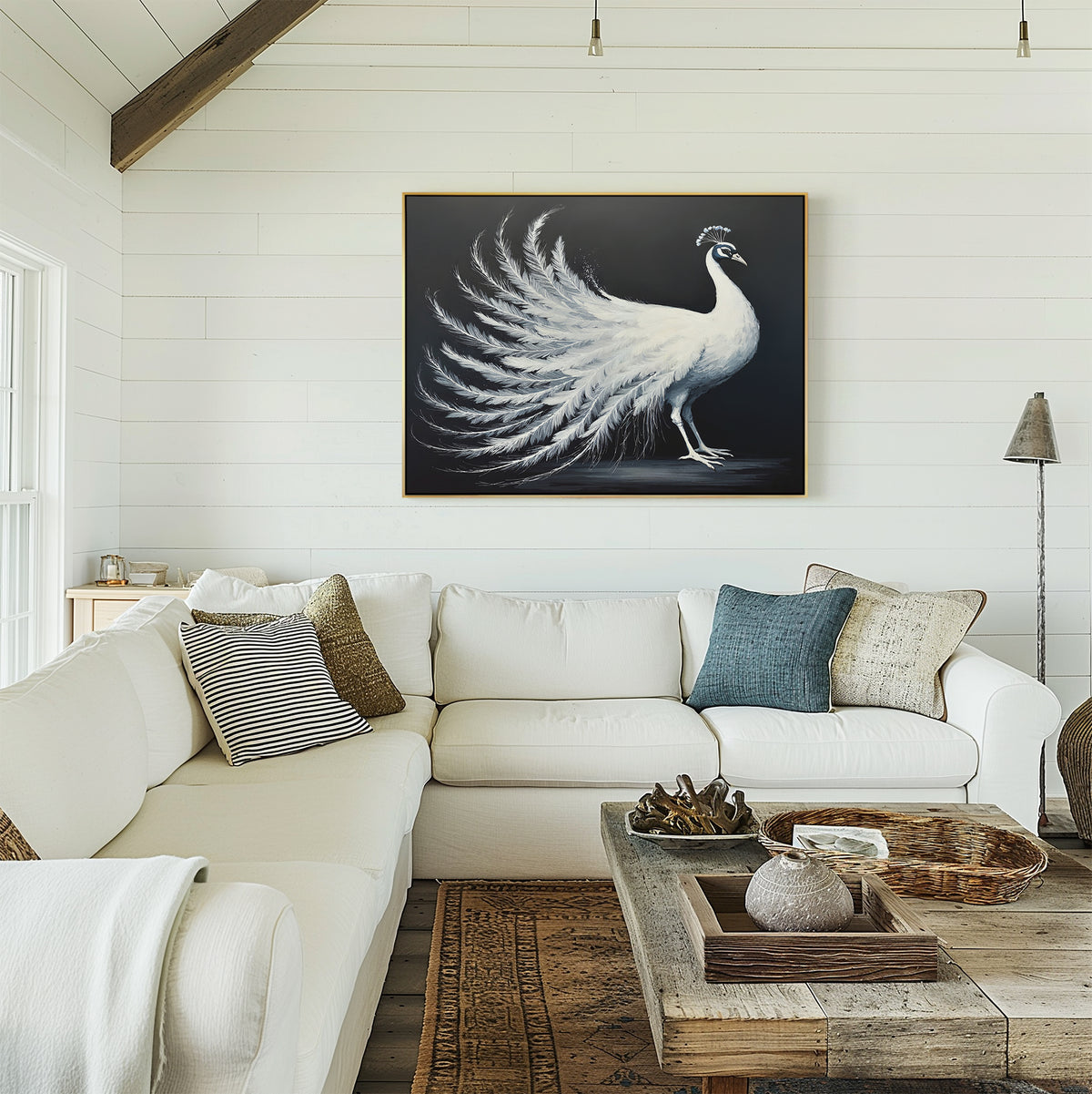 A bright living room with white shiplap walls, a large white sectional, an assortment of pillows, a rustic wooden coffee table, and the White Peacock Display Canvas Art - Horizontal elegantly hung above the sofa.