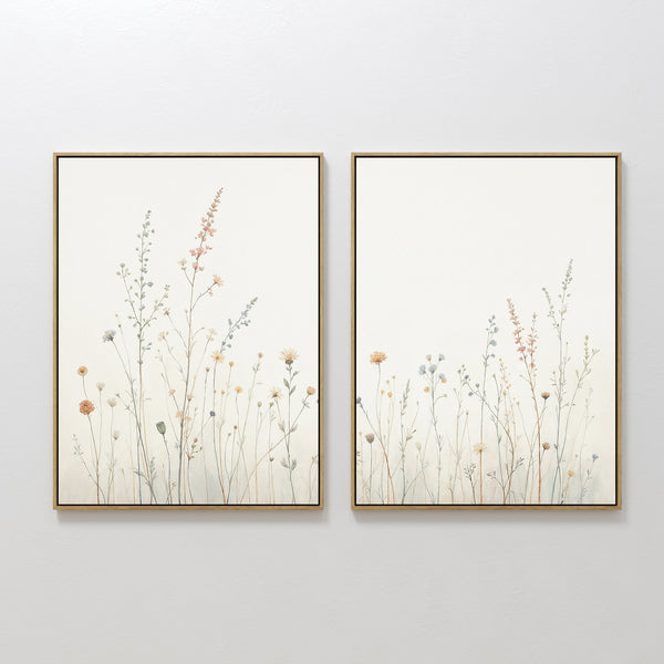 The Wildflower Dreams - Set of 2 features framed minimalist botanical prints with pastel wildflowers and slender stems on a neutral background, perfect for adding a serene Nordic Park touch to your space.