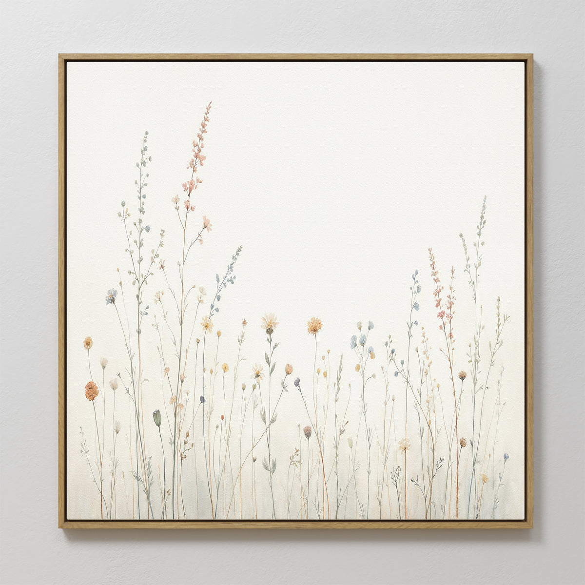 The Wildflower Dreams Canvas Art - Square features delicate, pastel wildflowers and grasses on a light background. Its minimalistic design brings a calm, natural vibe to any space.