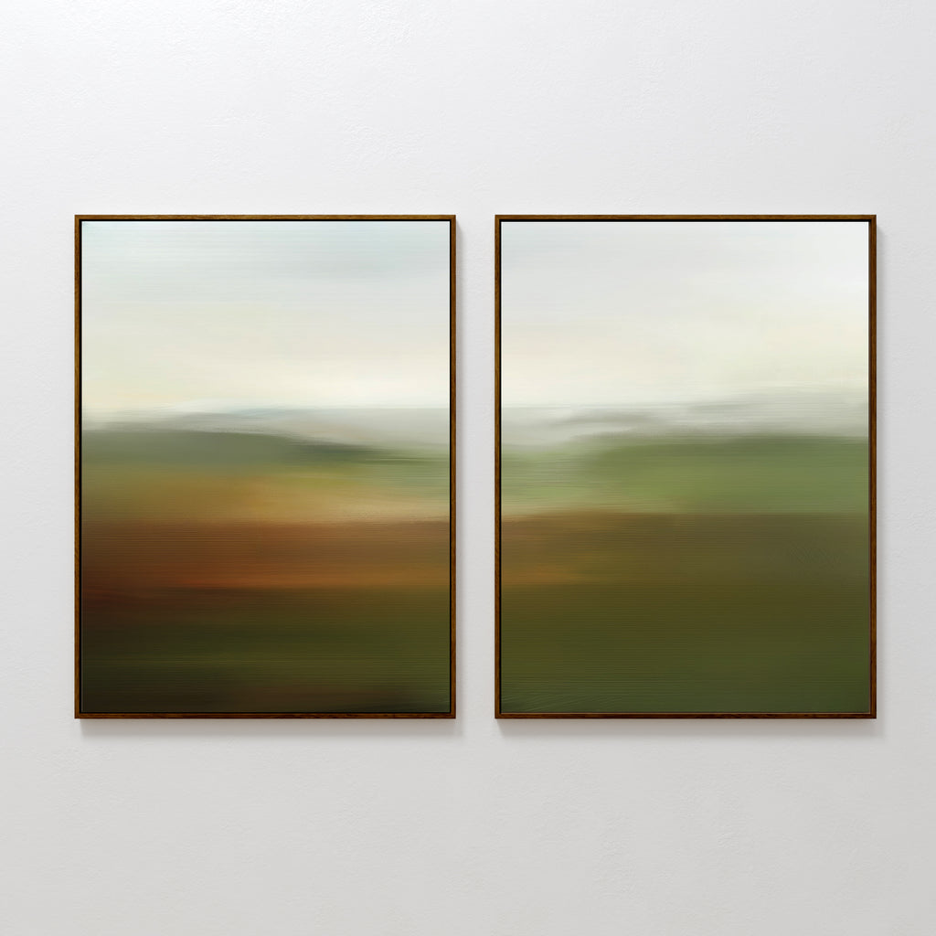 The Lush Landscape Set of 2 features framed abstract art with soft green, brown, and white tones, evoking serene fields or hills under a cloudy sky—perfect for adding elegant decor to your living room.