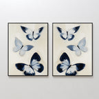 The Midnight Wings Set of 2 features side-by-side framed prints with three abstract blue and white butterflies on light beige—ideal butterfly wall art for modern decor with a hint of Nordic Park elegance.