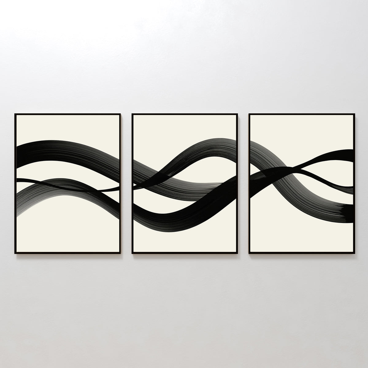 The Fluid Curves Set of 3 features framed abstract prints with black brushstrokes flowing across creamy backgrounds, forming a wavy, interconnected design—ideal as modern wall art to enhance your space.