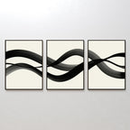 The Fluid Curves Set of 3 features framed abstract prints with black brushstrokes flowing across creamy backgrounds, forming a wavy, interconnected design—ideal as modern wall art to enhance your space.