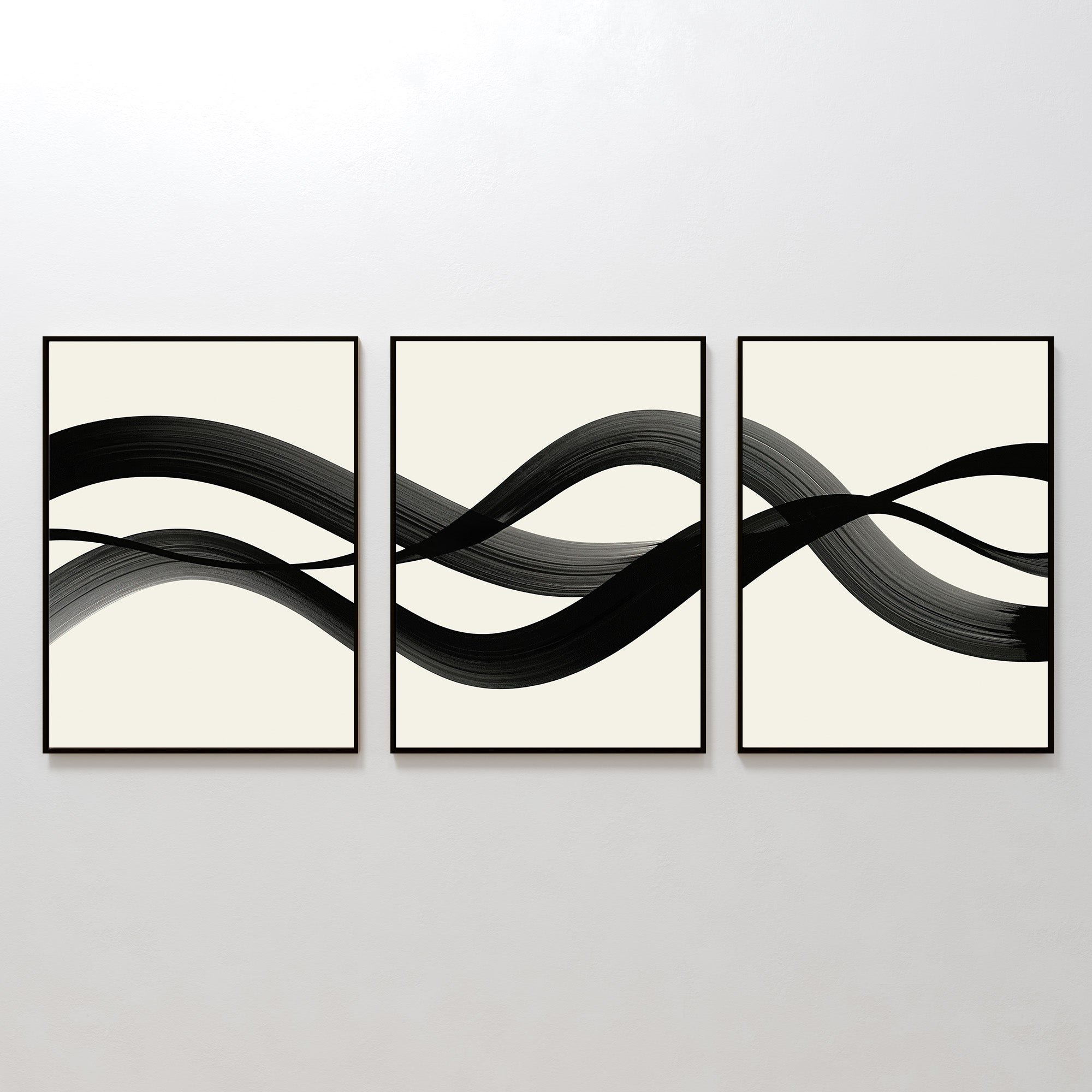 The Fluid Curves Set of 3 features framed abstract prints with black brushstrokes flowing across creamy backgrounds, forming a wavy, interconnected design—ideal as modern wall art to enhance your space.