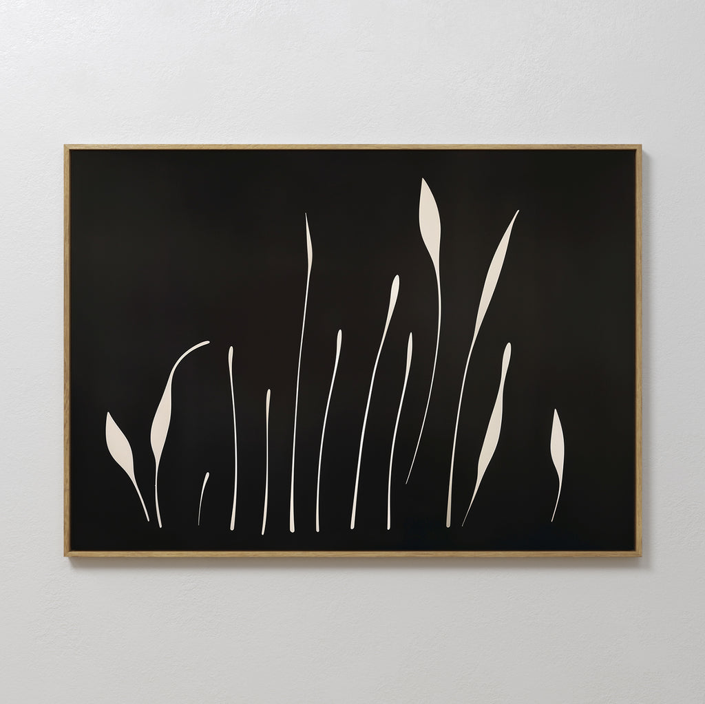 Botanical Silhouettes Abstract Canvas Art features minimalist cream plant shapes on a black background, set in a light wood frame and displayed on a white wall.