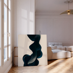 The Nocturnal Wave Abstract Canvas Art, featuring dark blue swirling shapes, leans against the white wall of a bright modern living room with parquet floors and a curved beige sofa—ideal for sophisticated decor.