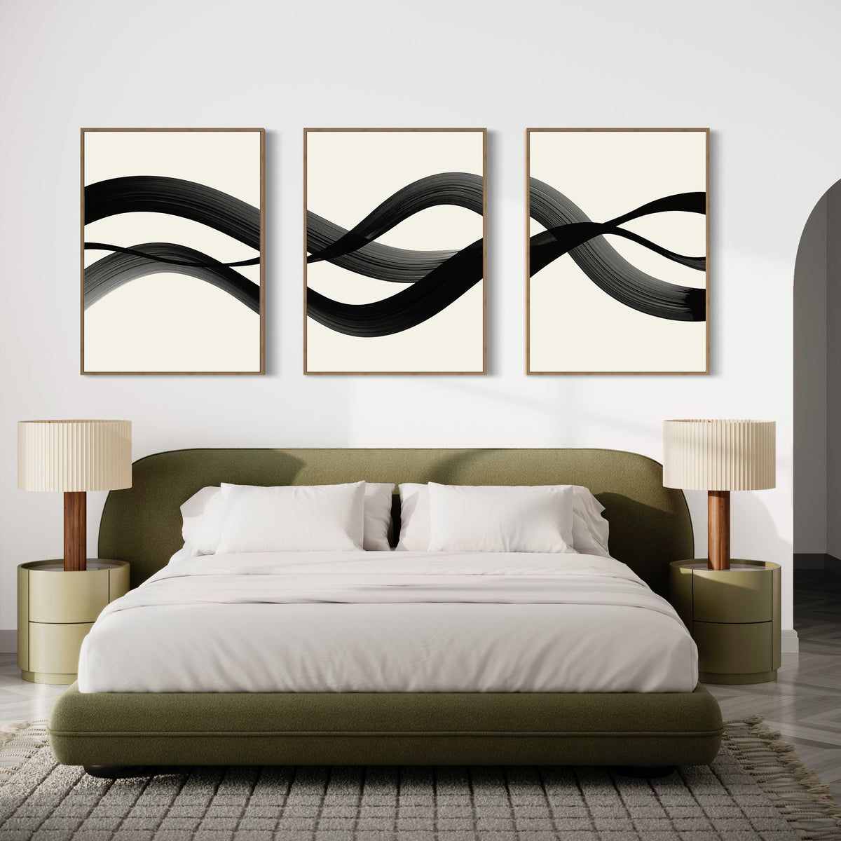 A modern bedroom features an olive green bed with white bedding, beige nightstands with matching lamps, and the Fluid Curves Set of 3 wall art above the bed, enhancing the minimalist decor and neutral palette.