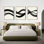 A modern bedroom features an olive green bed with white bedding, beige nightstands with matching lamps, and the Fluid Curves Set of 3 wall art above the bed, enhancing the minimalist decor and neutral palette.