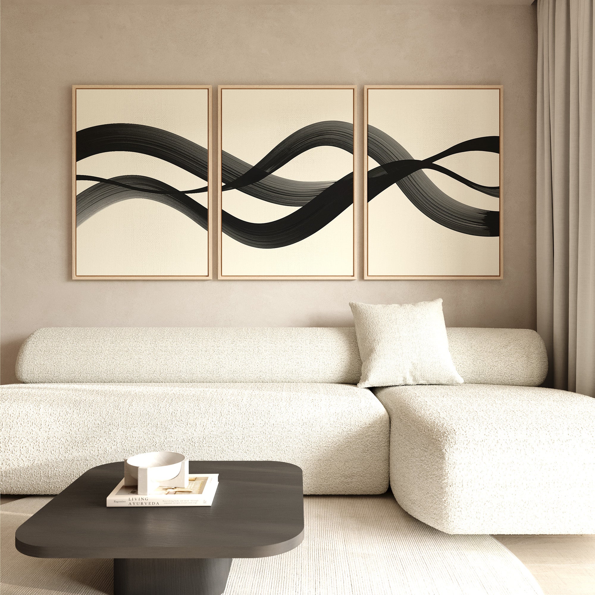 Minimalist living room featuring a light textured sofa with single cushion, dark coffee table, and Fluid Curves Set of 3 wall art above the couch. Soft neutral tones and natural light create a calm, Nordic Park-inspired vibe.