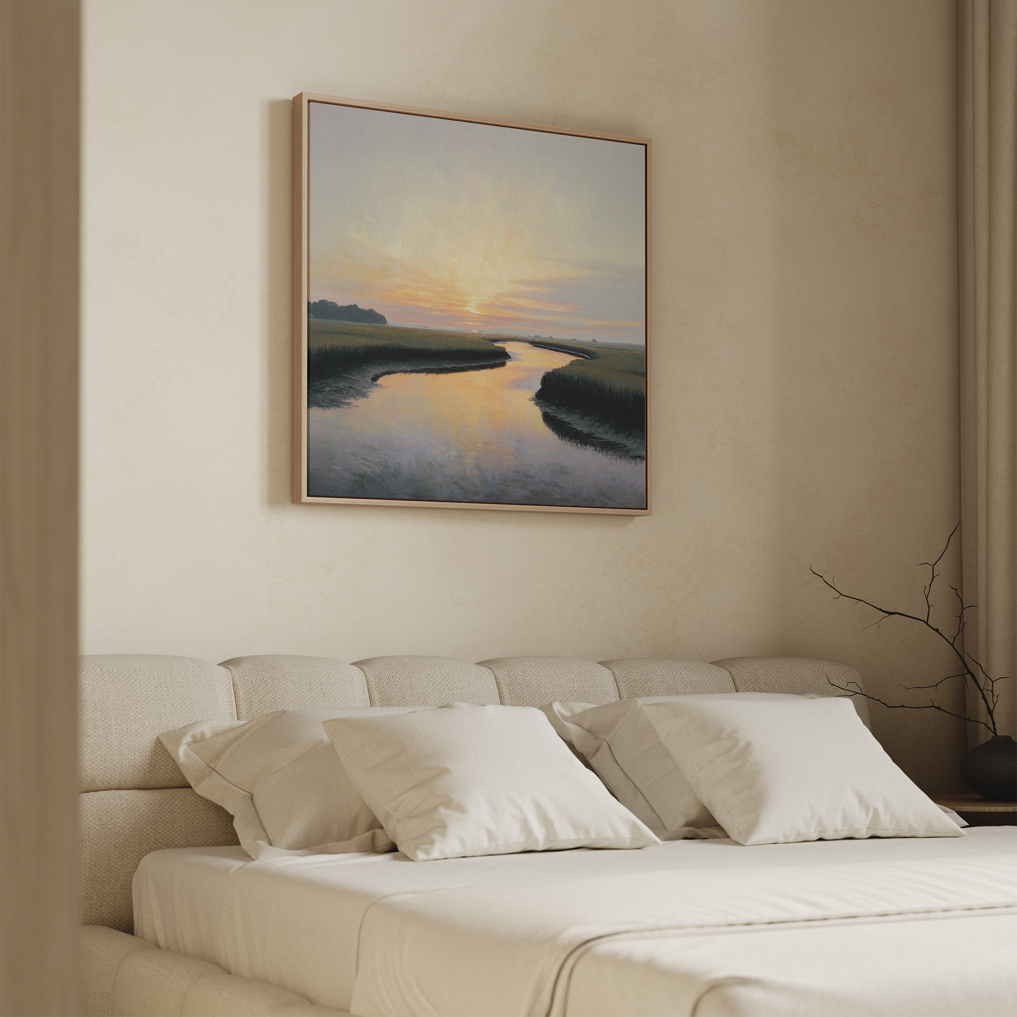 A neutral-toned bedroom features an upholstered bed with white bedding and three pillows. Above the bed hangs the Tidal Whispers Canvas Art - Square, while a branch decorates the minimalist nightstand for a serene ambiance.