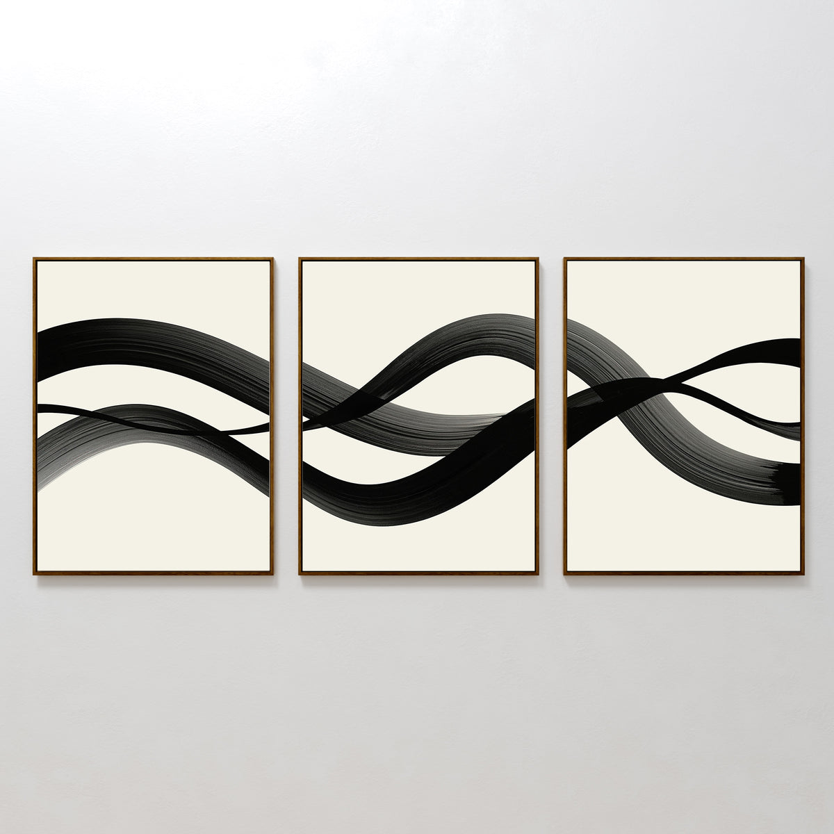 The Fluid Curves Set of 3 features framed abstract artworks with black wavy brushstrokes on white backgrounds, forming a continuous flowing design—ideal as modern wall art or part of a curated collection.