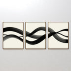 The Fluid Curves Set of 3 features framed abstract artworks with black wavy brushstrokes on white backgrounds, forming a continuous flowing design—ideal as modern wall art or part of a curated collection.