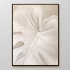 Leaf Whisper Abstract Canvas Art showcases a close-up of a pale monstera leaf in soft beige and white tones on a neutral background, making it the ideal minimalist wall art for modern spaces.