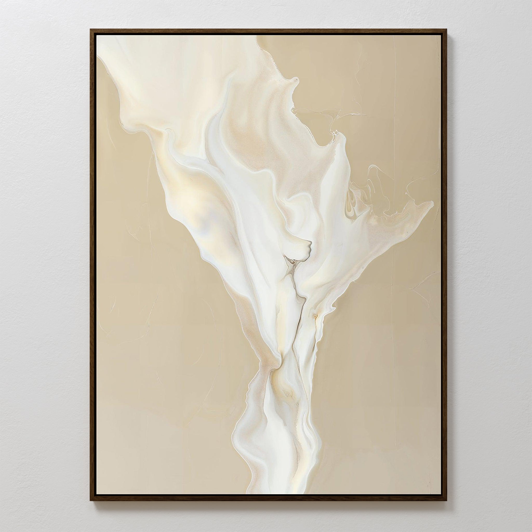 The White Flame Abstract Canvas Art features swirling cream and beige tones in a fluid, marble-like pattern. This minimalist piece is framed with a slim dark border and displayed against a light wall for a contemporary look.
