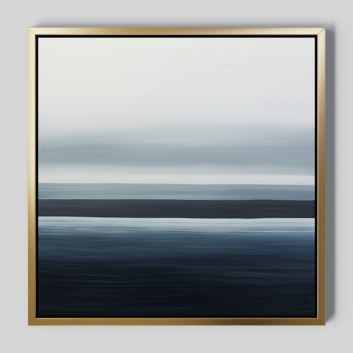 Oceanic Blur Abstract Canvas Art features horizontal blue and white gradients reminiscent of ocean waves and sky, set in a slim gold frame on a light gray background—ideal minimalist decor for a coastal-inspired living room.