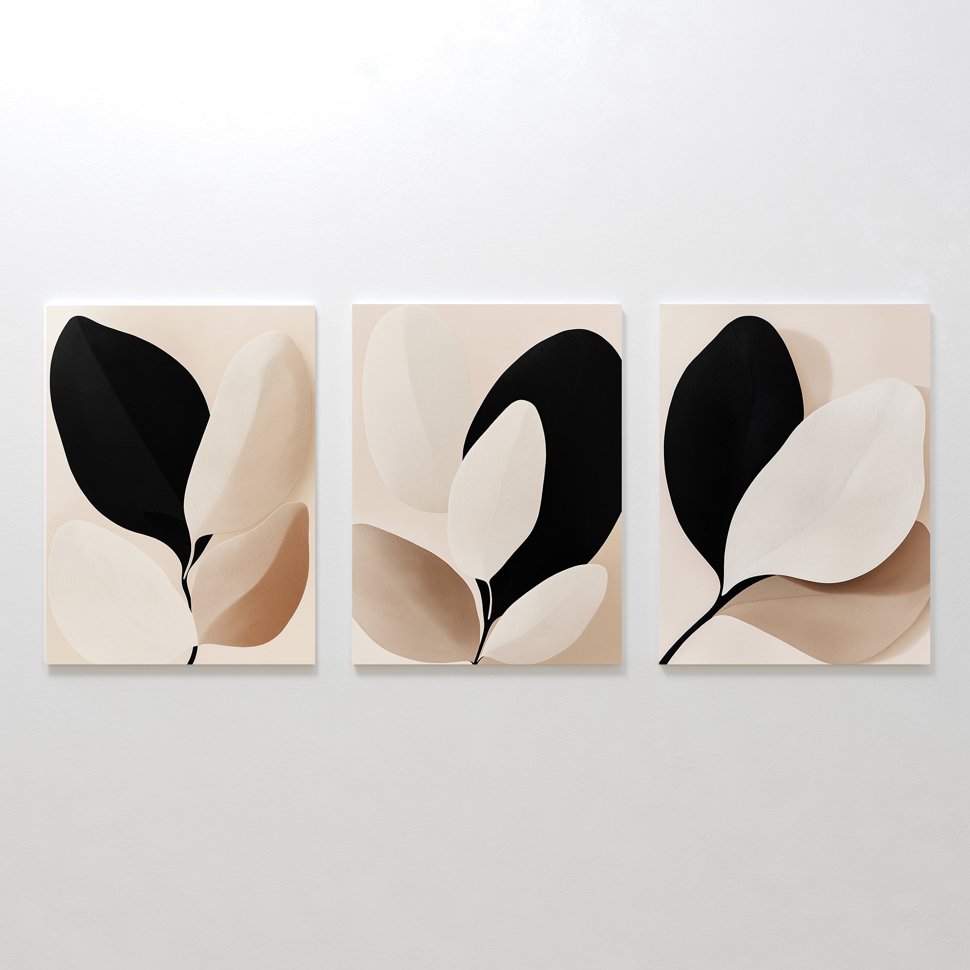 The Monochrome Flora Set of 3 features minimalist botanical prints with abstract leaf shapes in black, beige, and cream—perfect botanical wall art for modern living room decor.