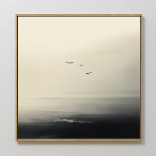 The Above the Calm Canvas Art features three birds soaring over a misty seascape in soft, muted tones—ideal as minimalist wall art or bedroom decor to bring a serene, tranquil atmosphere to your space.