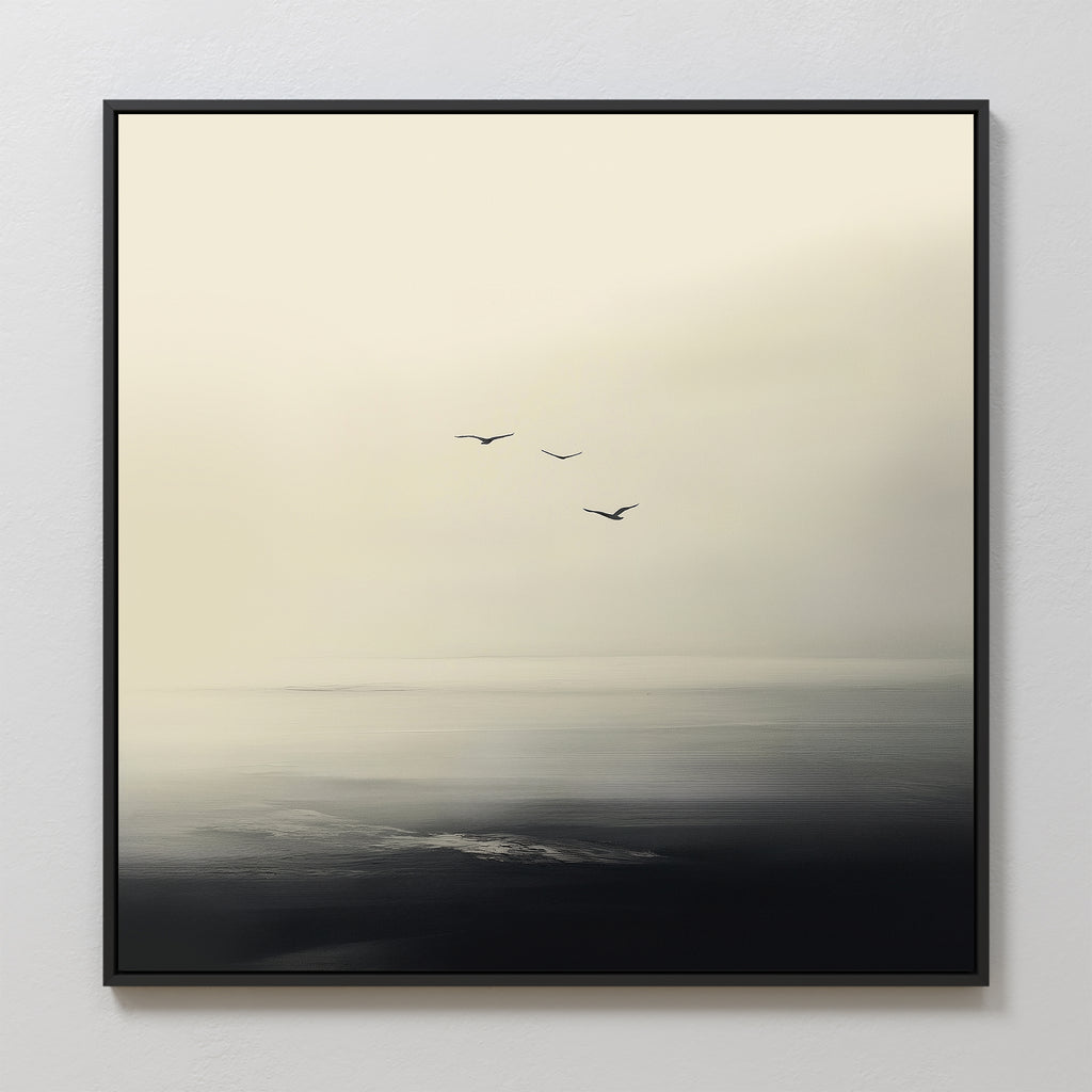 Above the Calm Canvas Art depicts three birds soaring over a misty, tranquil sea in soft, muted tones. This minimalist framed piece adds serene elegance to any large living room or peaceful bedroom decor.