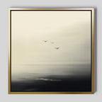 Above the Calm Canvas Art features three birds soaring over a misty seascape in muted gray, white, and black tones. Ideal for large living room decor, this minimalist framed painting adds a serene, tranquil vibe to any space.