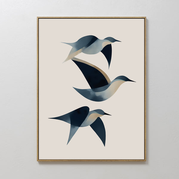 Abstract Birds in Motion Canvas Art features three stylized birds in blue, white, and beige soaring diagonally on a light beige background. Framed in sleek gold, this modern print brings Nordic Park-inspired elegance to any space.