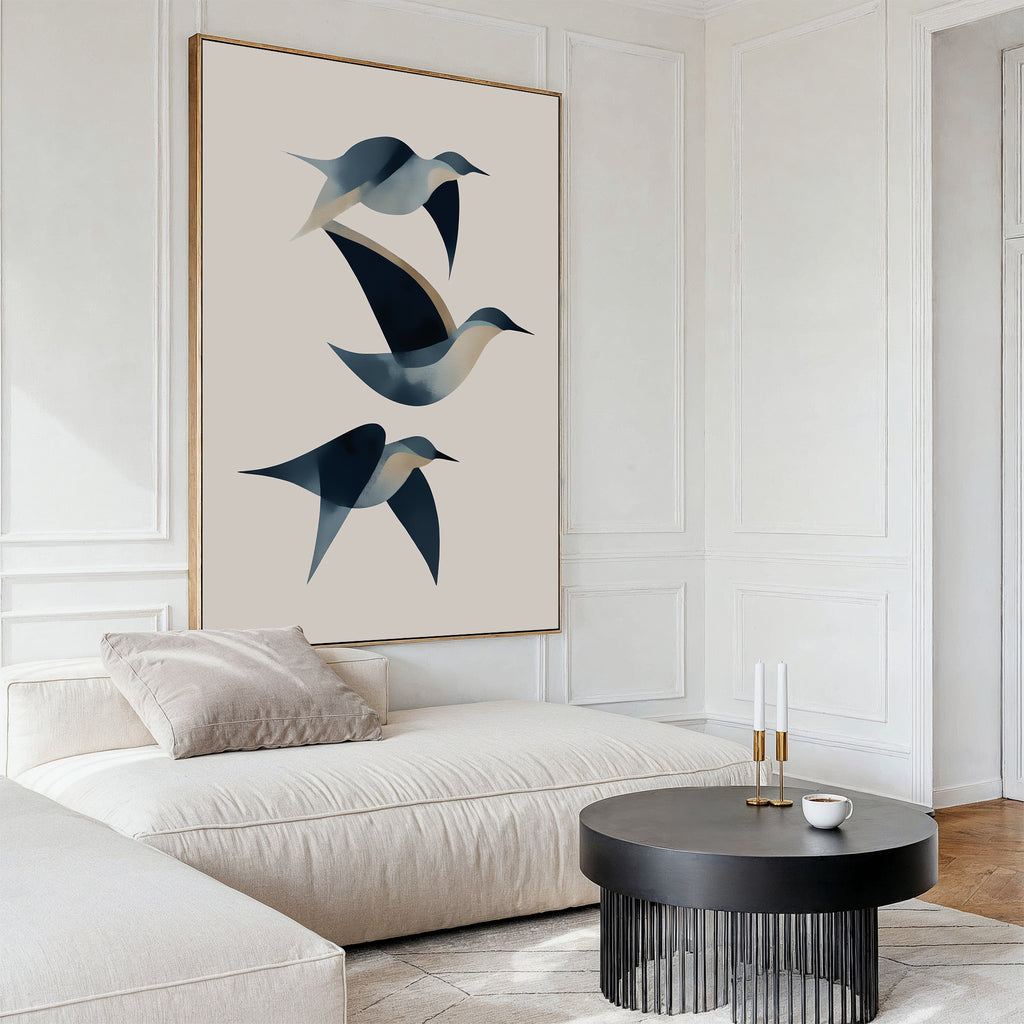 A modern living room with a white sectional sofa, beige cushions, a round black coffee table, and the Abstract Birds in Motion Canvas Art. White paneled walls and minimalist décor evoke a serene Nordic Park-inspired atmosphere.