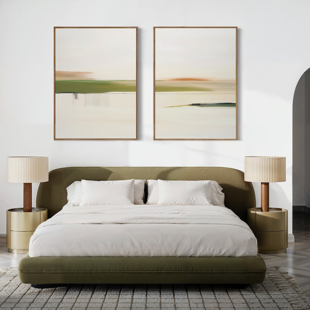 A modern bedroom with an olive green low-profile bed, white bedding, two beige nightstands with pleated lamps, and the Abstract Horizons Set of 2 minimalist landscape canvases above the bed on a white wall.