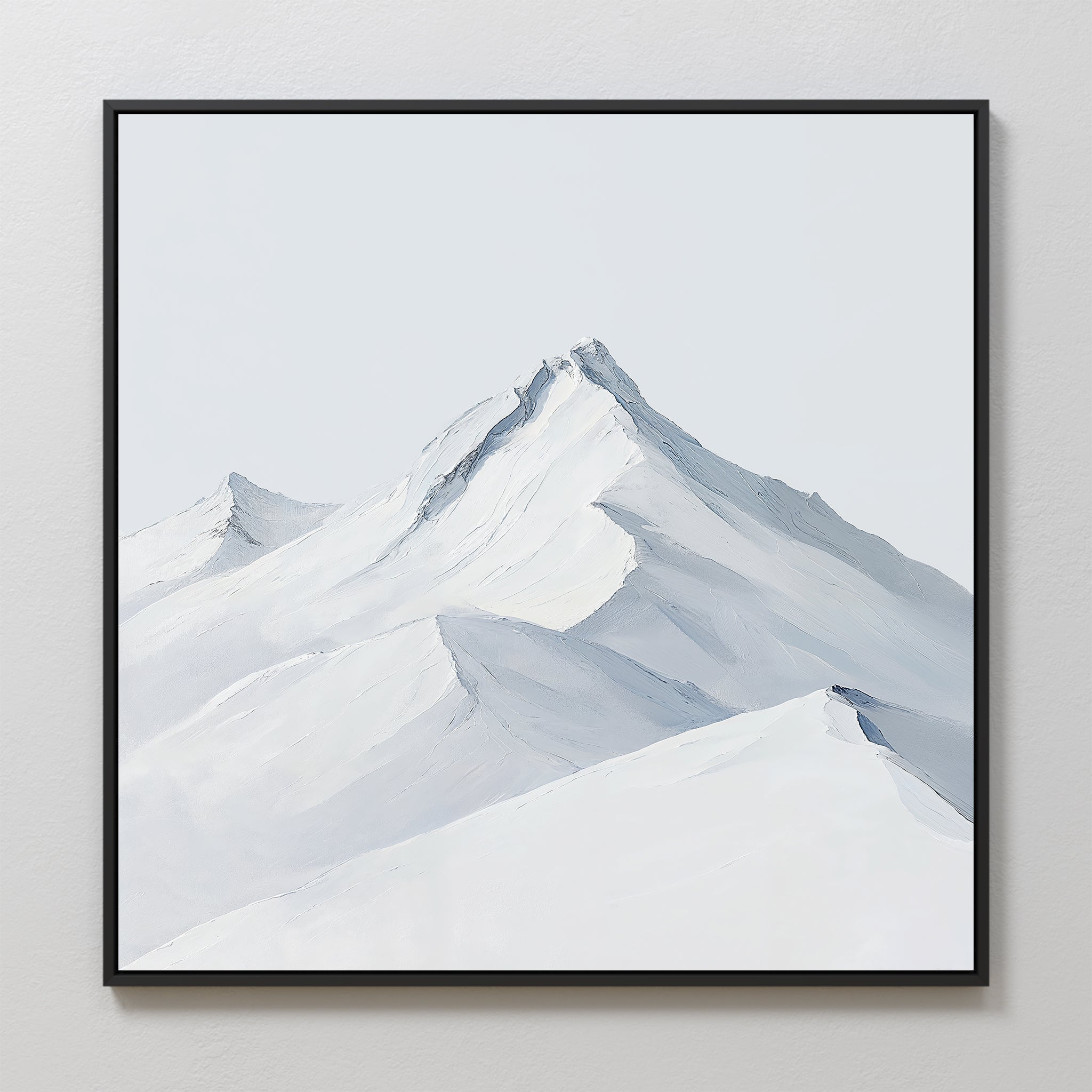 Alpine Ascent Abstract Canvas Art features a minimalist depiction of snow-covered mountain peaks in white and light gray with a sleek black frame, ideal for bringing a serene ambiance to your living room decor.