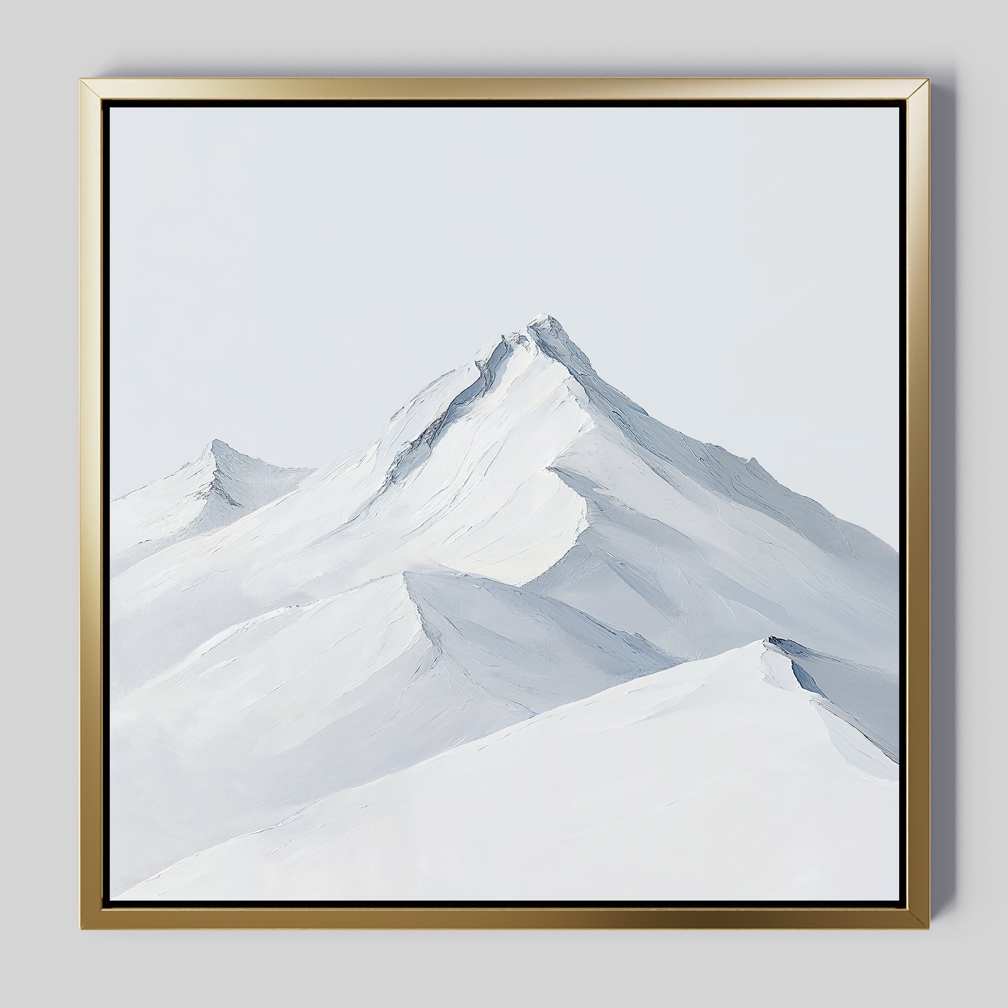 Alpine Ascent Abstract Canvas Art features a minimalist depiction of snow-covered peaks and soft blue-gray shadows in a gold-edged frame, creating elegant wall decor for your living room.
